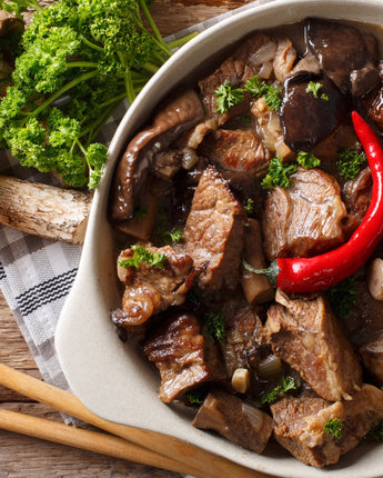 Beef stew with wild mushrooms, onions, and chili pepper