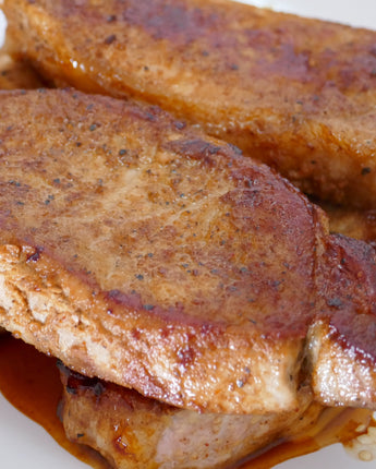 Cooked and marinated pork chops on a plate